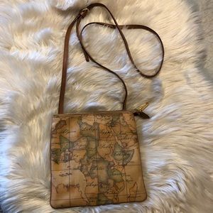 Tilasse Alviro Martin coated canvas map print crossbody with leather strap.